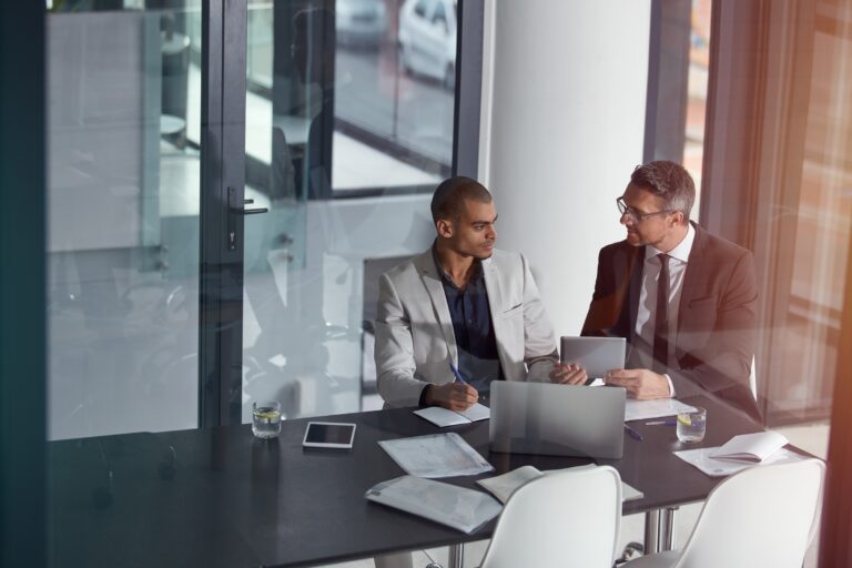 Two men talking at the table